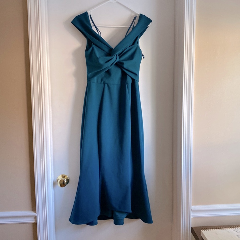 Deep teal midi length cocktail dress with mermaid hem.